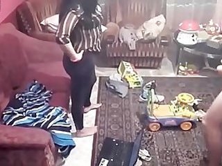 Spy camera records couple fucking in the living room.